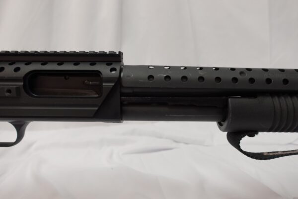 Mossberg 590 Shockwave SPX 12 Ga  12/14.3" Picatanny Rail/Heat Shield; 2 grips. 50648